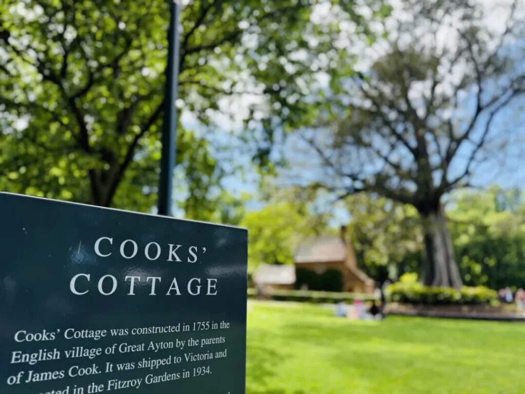 Cooks' Cottage sign and historic 1755 English cottage at Fitzroy Gardens Melbourne