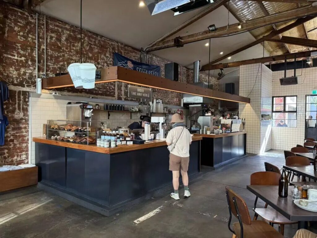 Industrial style interior and espresso bar at Seven Seeds Coffee Roasters Melbourne