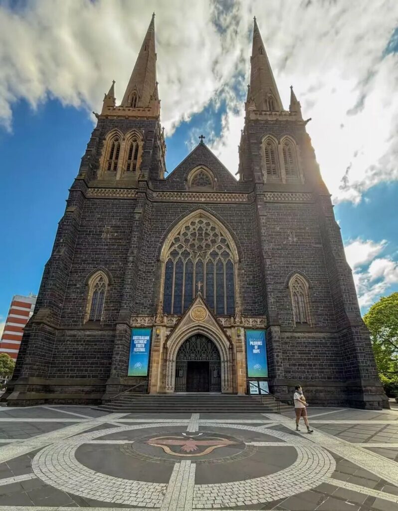 St Patrick's Cathedral Gothic twin spires front facade in Melbourne CBD Victoria Australia