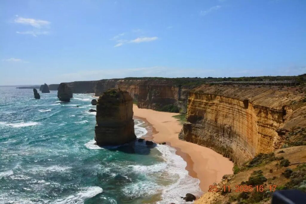 Twelve Apostles sea stacks with golden sand beach and towering cliffs Great Ocean Road