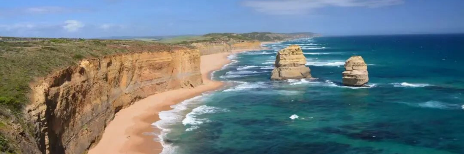 Twelve Apostles limestone coastline with golden beach on Great Ocean Road Victoria banner